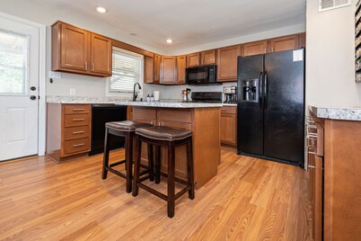 Open 4BR/2BA • Sleeps 8 • Huge Kitchen, Covered Deck & Easy Highway Access