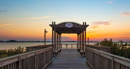 Bayside Resort condo with pools, saunas, athletic courts, on-site golf, and pier