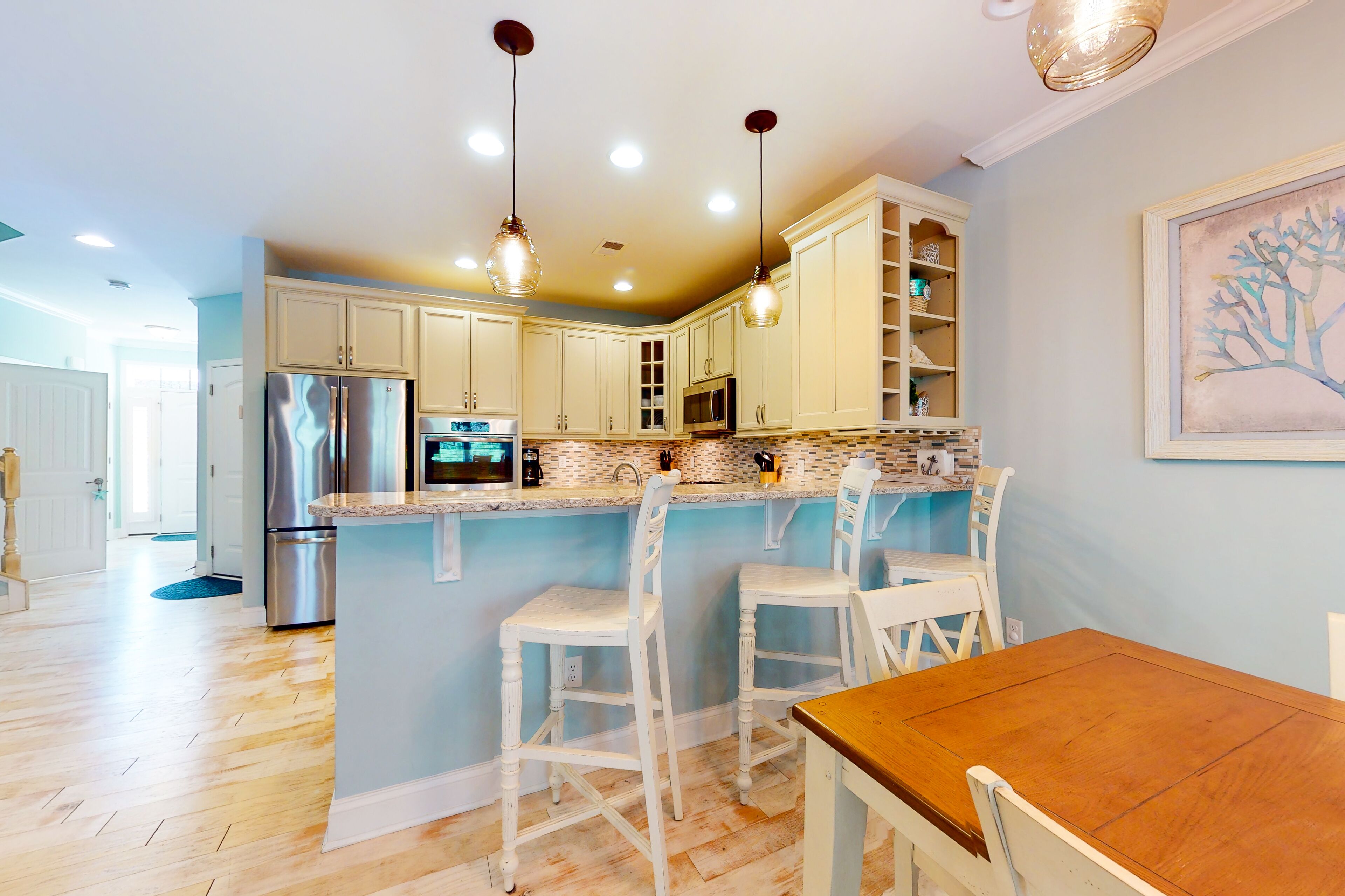 Bayside Resort condo with pools, saunas, athletic courts, on-site golf, and pier