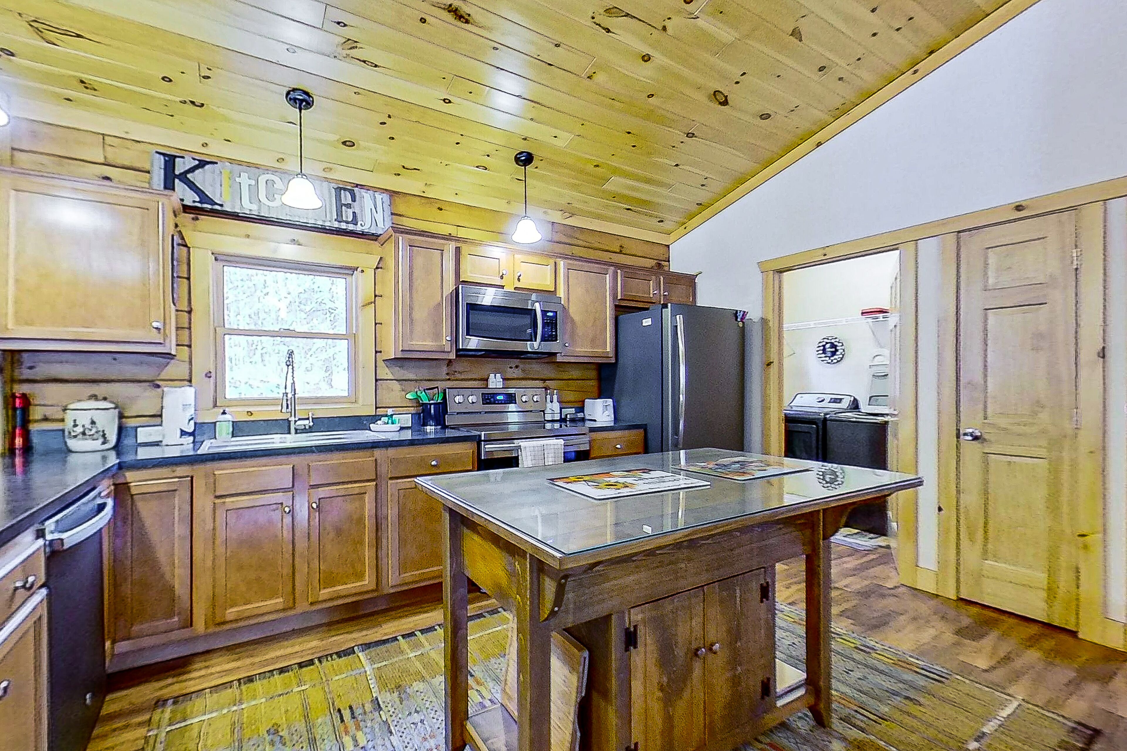 Riverfront dog-friendly home with firepits, dock, wood stove, & beach