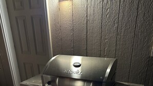 A NexGrill barbecue grill with four burners, a digital display, and a control knob. - #1 Greenside Oasis (Mattawa)