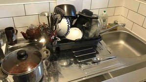 A kitchen with a sink, a stove, and various kitchen utensils and dishes. - Studio with a view, great transport links to central London (London)
