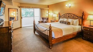 A hotel room with a large bed, a chair, a desk, and a TV. - Capital Vacations Sedona Springs Resort - 2 Bedroom (7-Night) (Sedona)