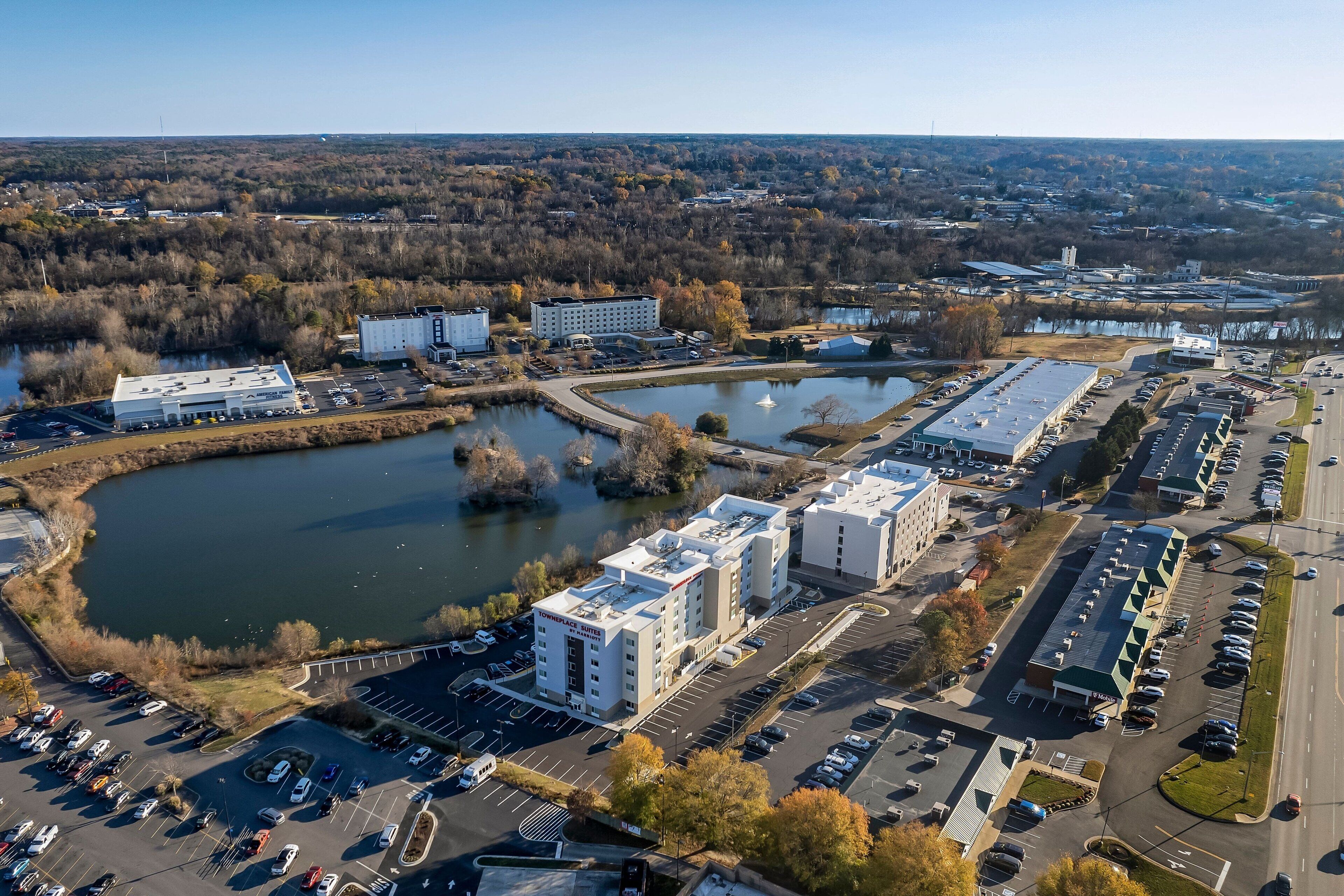 An industrial area with a large parking lot, a building labeled "Pinnacle Health," and a body of water.
