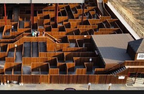 A maze-like structure with multiple levels and pathways, likely designed for entertainment or exploration. - Secluded Luxury Retreat with EV Charger (Broken Bow)