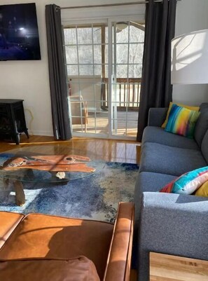 Smart TV, fireplace, books, printers