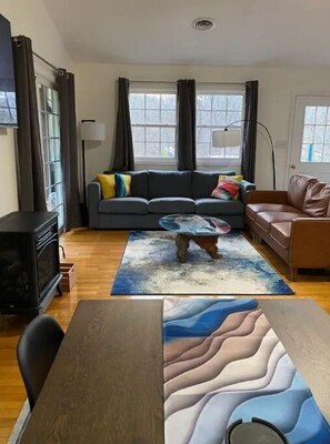 Smart TV, fireplace, books, printers