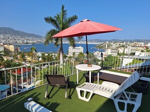 Family Room, 2 Queen Beds, Air conditioning, Ocean View | Terrace/patio