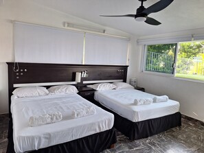 Superior Quadruple Room, 2 Queen Beds, Air conditioning, Partial Sea View | In-room safe, blackout drapes, iron/ironing board, free WiFi