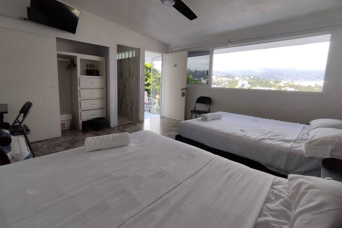 Family Room, 2 Queen Beds, Air conditioning, Ocean View | In-room safe, blackout drapes, iron/ironing board (on request)