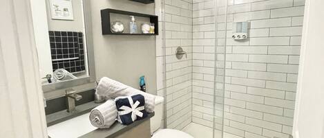 Shower, hair dryer, towels, soap