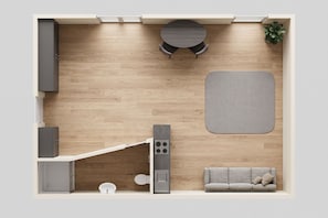 A compact kitchen with a dining area, a sofa, and a small table. - Kleines Gemütliches Ferienzimmer für Max. 2 Person im Herzen von Heringsdorf - Villa Seeland (Heringsdorf)
