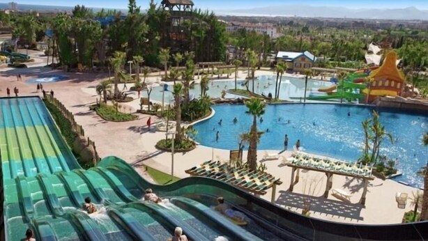 A water park with multiple slides and a large pool area. - APARTBEACH FLUROMAR AIR-CONDITIONED RELAX NEXT TO THE BEACH (Salou)