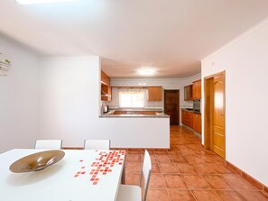 Enjoy meals in the kitchen with a central island and dining area.