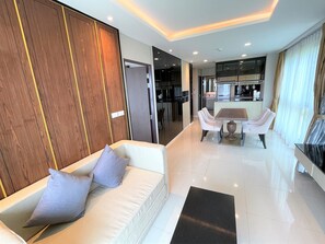Luxury Apartment, 2 Bedrooms, Sea View | Living area | 38-inch flat-screen TV with cable channels, TV