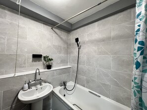 Shower, hair dryer, towels