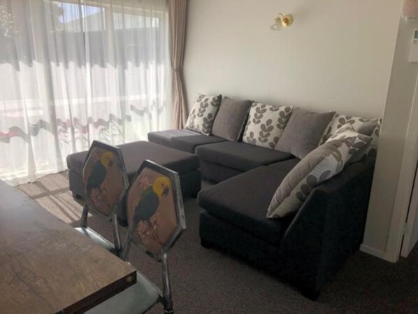 Two Bedroom Apartment | Living area | 29-inch flat-screen TV with cable channels, TV