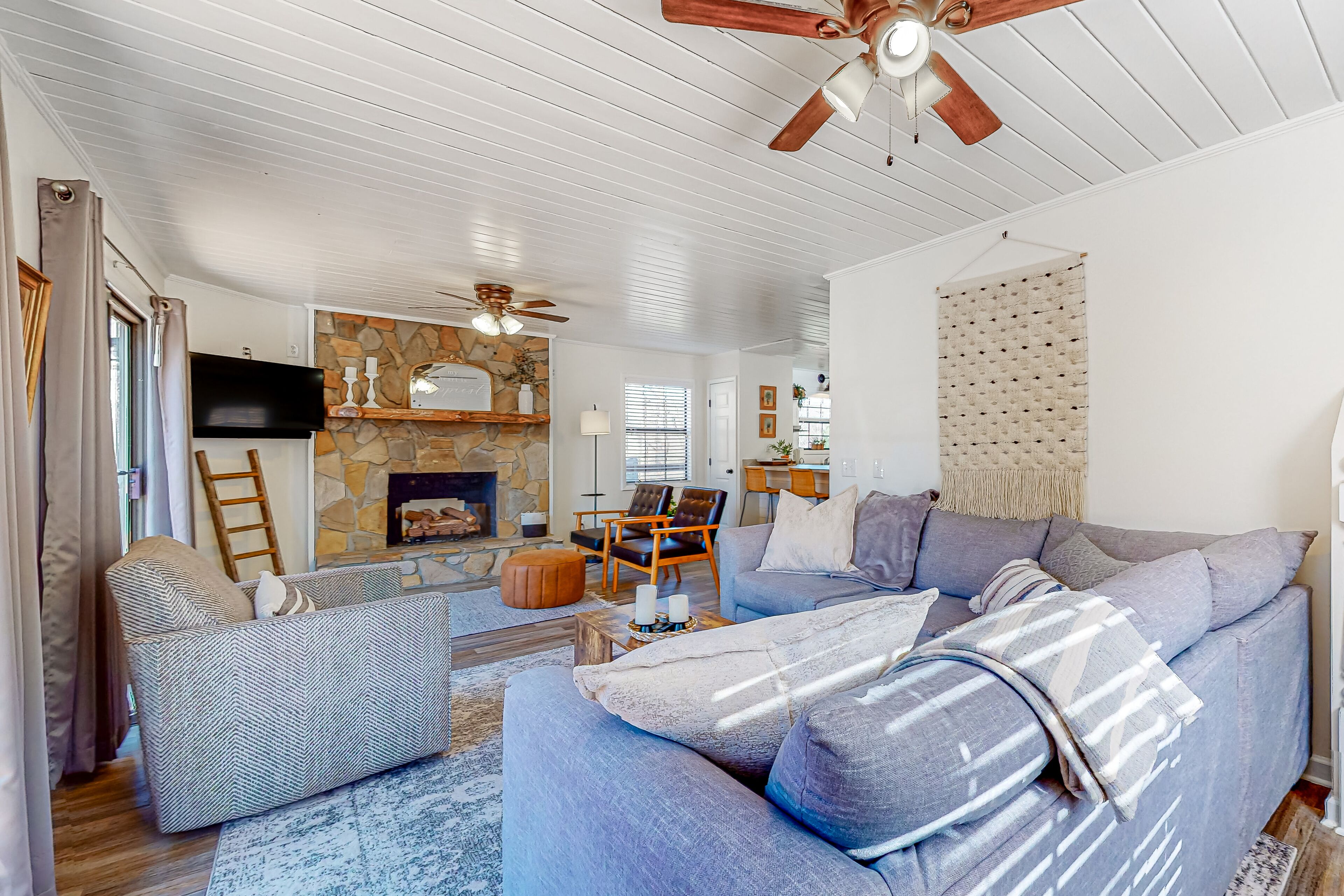 Spacious creekside home with deck, firepit, grill, water views, & washer/dryer