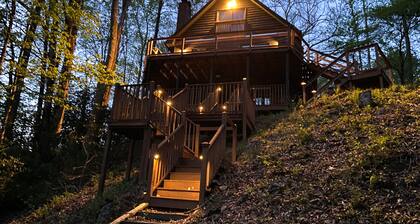 Spacious creekside home with deck, firepit, grill, water views, & washer/dryer