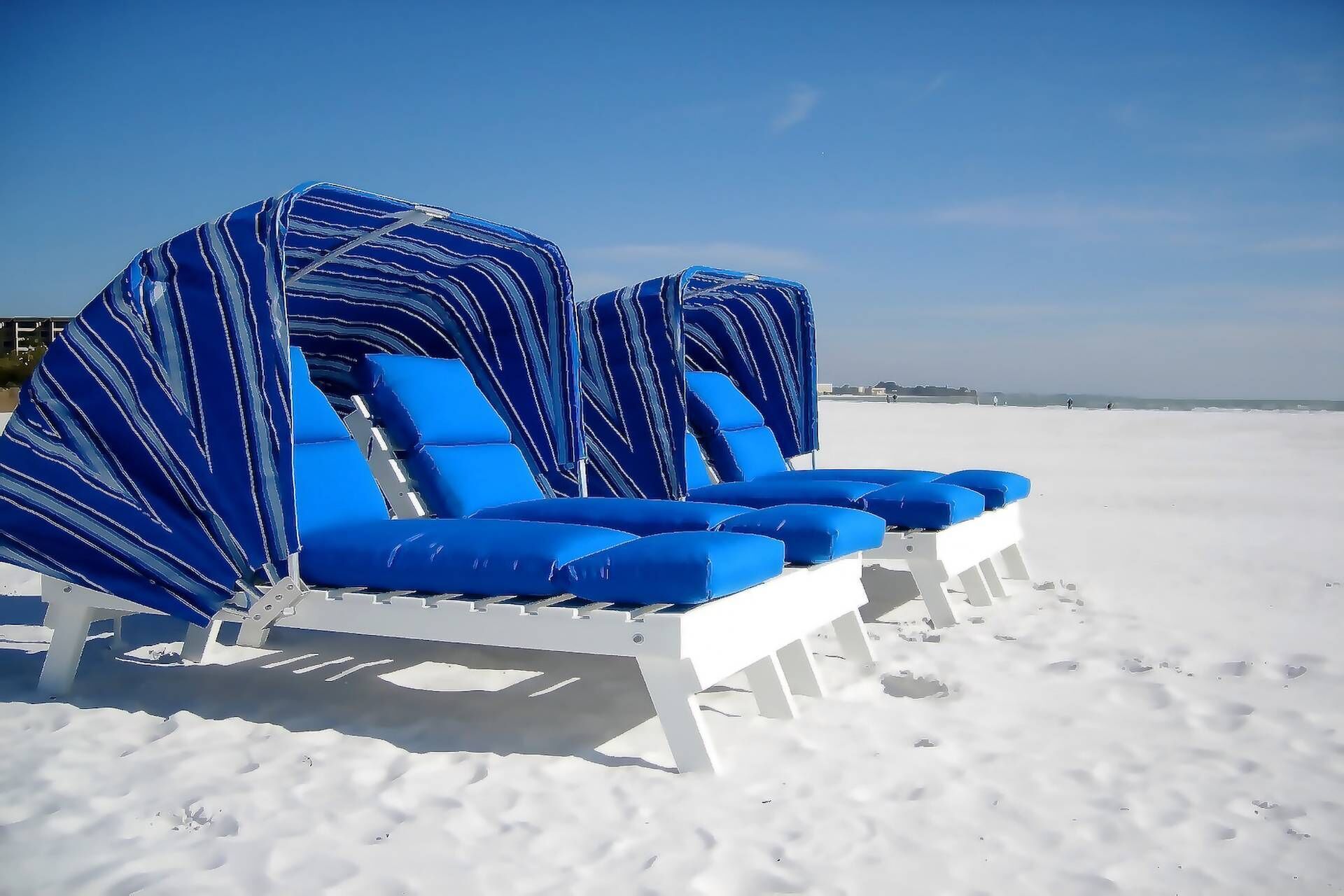 On the beach, sun loungers, beach towels, kayaking