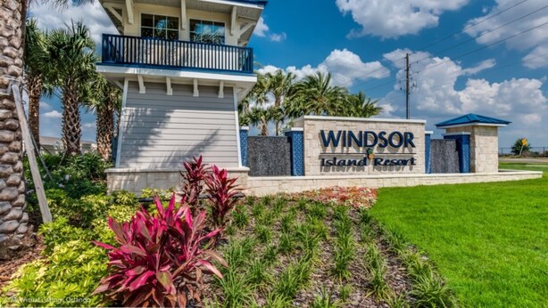 A sign for Windsor Island Resort with a two-story building and a covered balcony. - Secluded 10 Bedroom Villa With Ocean Views 6282 (Davenport)