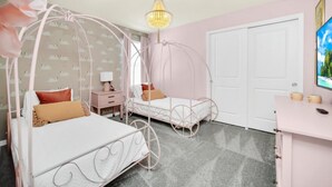 A bedroom with a canopy bed, a desk, and a TV. - Secluded 10 Bedroom Villa With Ocean Views 6282 (Davenport)