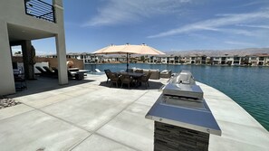 Outdoor dining - Spacious home in Palm Springs area, Indio. Close to all festivals. Sleeps 14+ (Indio)