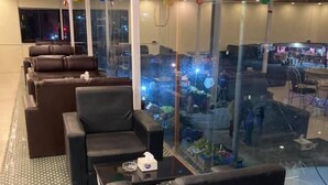 A modern lounge area with leather sofas and a checkered floor. - Sindhuligadhi Mountain Resort (Ratanchura)