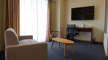 Basic Triple Room, 3 Bedrooms | Living area | 50-inch flat-screen TV with digital channels, TV