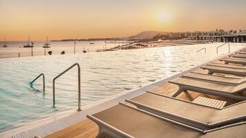 Outdoor pool, pool umbrellas, sun loungers