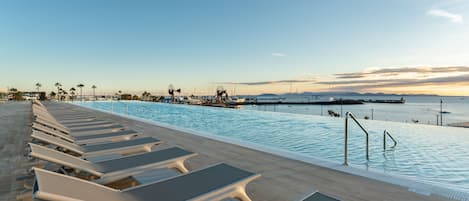 Outdoor pool, pool umbrellas, sun loungers