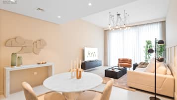 Departamento de lujo, 1 habitación | Área de sala de estar | Smart TV de 55 pulgadas con canales por cable, televisión y Netflix