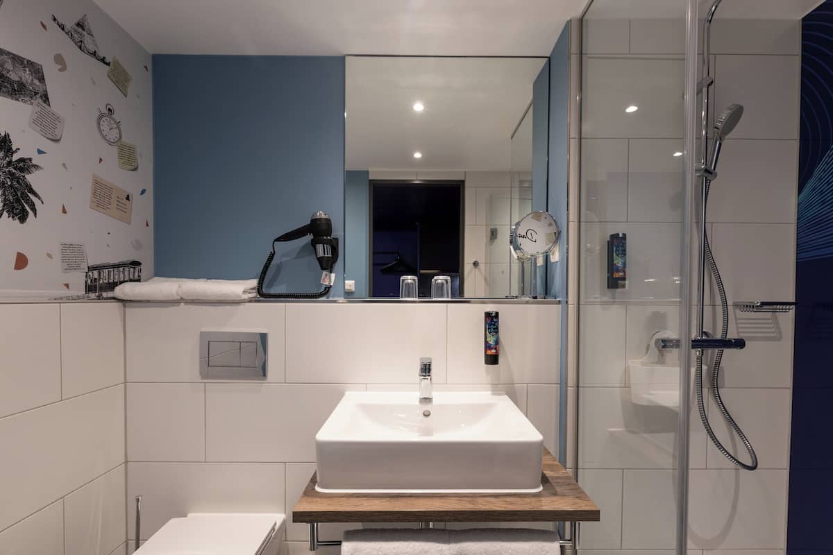 Shower, towels, soap, toilet paper