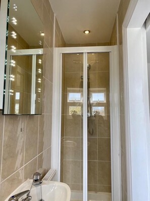 Shower, hair dryer, towels, soap