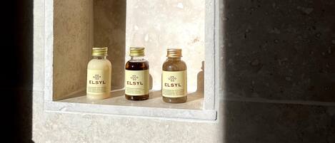 A shelf with three ELSYL products in a well-lit alcove.