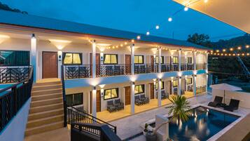 Experience the perfect blend of modern design and relaxation at this stylish hotel, featuring a rooftop balcony and inviting pool area.