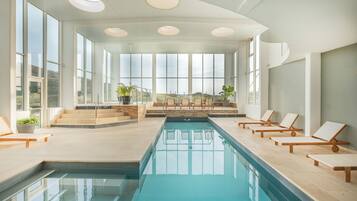 Indoor pool, open 8:00 AM to 8:00 PM, pool loungers