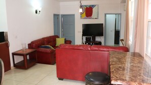 Family Apartment | Living area | 50-inch Smart TV with cable channels, TV