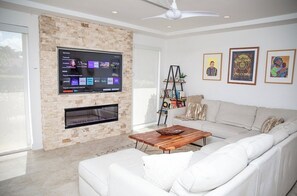 Smart TV, fireplace, books