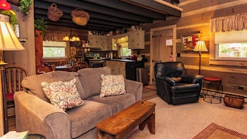 Cabin, 1 King Bed | Living area | 32-inch flat-screen TV with cable channels, TV