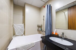 Deluxe Apartment | Bathroom | Bathtub, designer toiletries, hair dryer, slippers - David Housing in Linh Lang near Lotte (Hanoi)