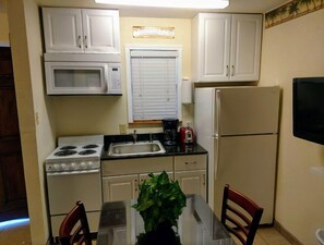 Fridge, microwave, cookware/dishes/utensils