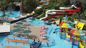 A water park with multiple slides and pools, including a lazy river and a wave pool. - Far Life Hotel (Konyaalti)