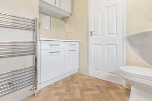 Separate tub and shower, deep soaking tub, hair dryer, towels
