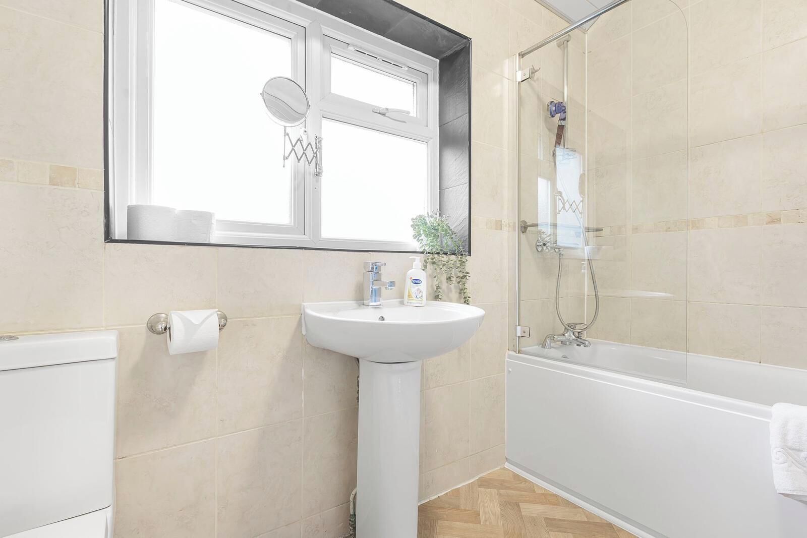 Separate bathtub and shower, deep-soaking bathtub, hair dryer, towels