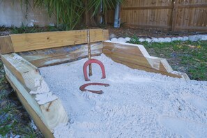 Kids can play on the playground equipment and swing set.