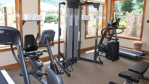 A gym with various exercise equipment, including a treadmill, elliptical, and weight machines. - Condo w/ Creek, Golf & Mtn Views, Only 5 Steps to get in and Washer & Dryer! (Whittier)