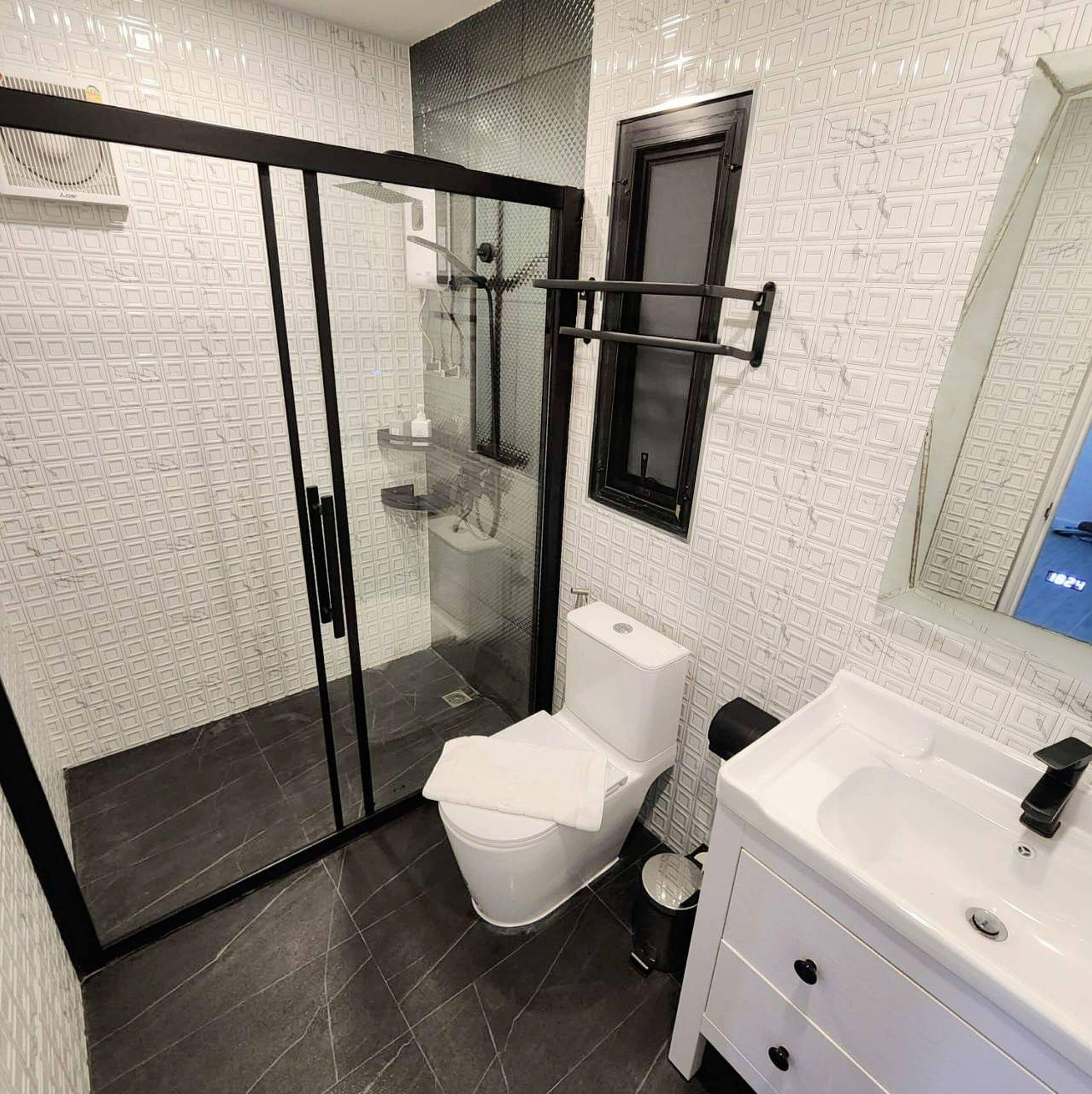 deluxe double room | bathroom | shower, rainfall showerhead, towels, soap