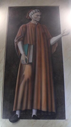 A portrait of a person in historical attire, standing against a dark background. - affittacamere i due cavalieri (Turin)
