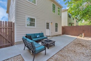 Enjoy a home away from home with a patio area featuring a sofa and coffee table.